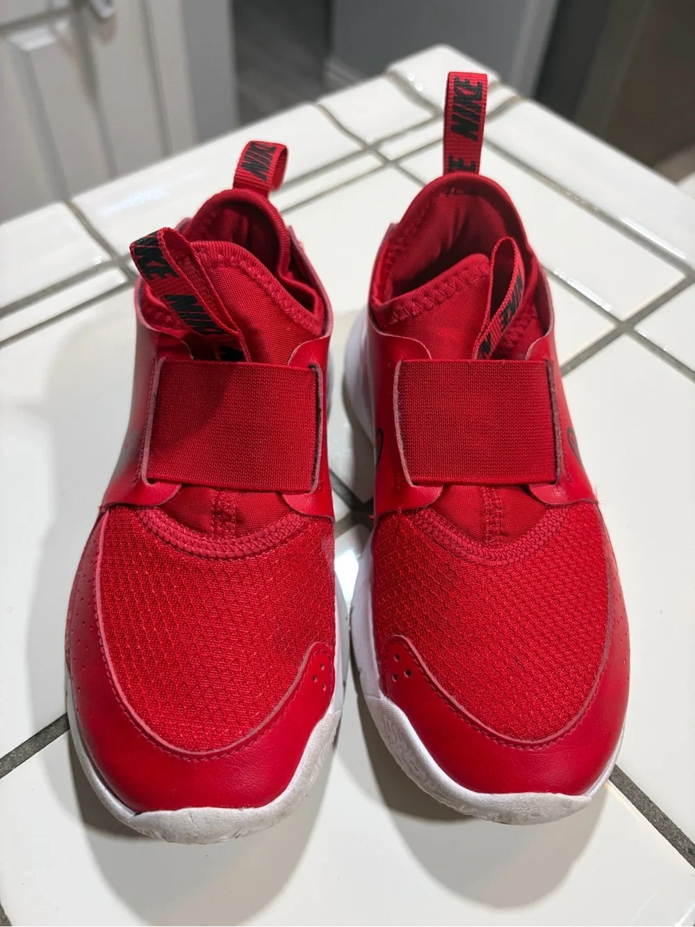 Nike Kids Slip-On Athletic Sneakers in Red and Black